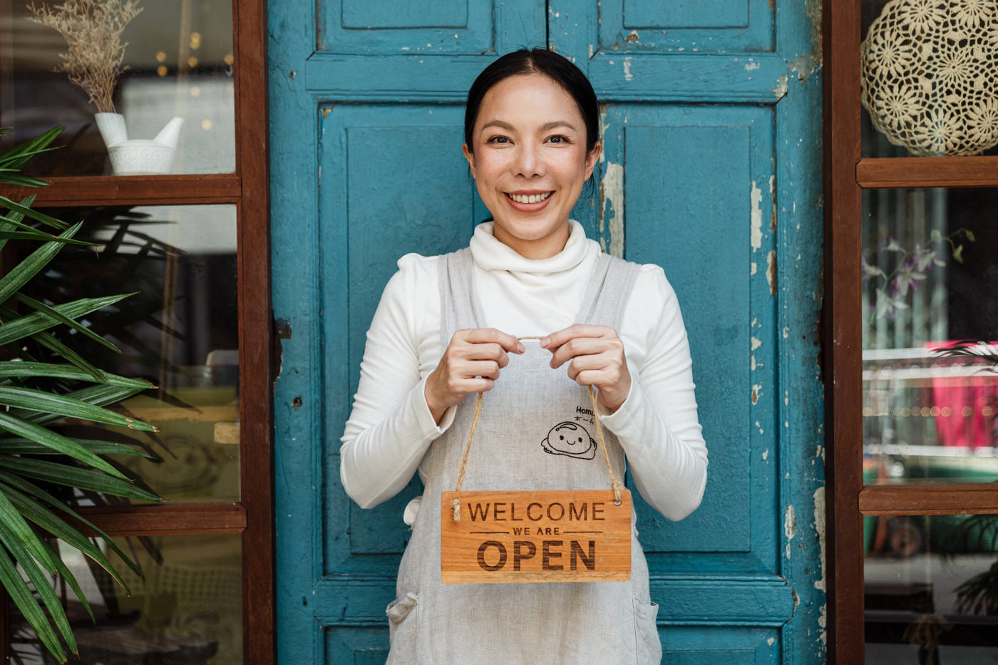 Image of woman holding sign