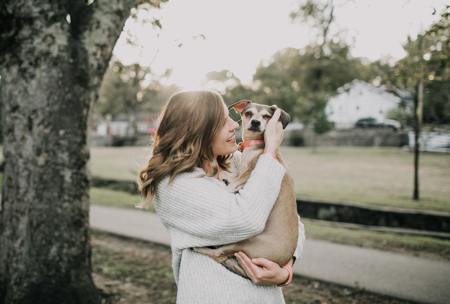 Woman holding a small dog