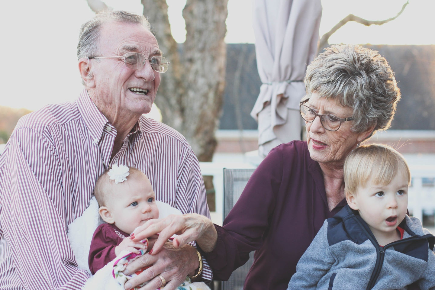 Grandparents holding grandchildren
